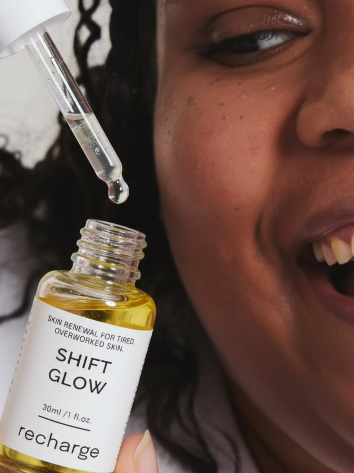 Nurse applying ShiftGlow Recharge serum with dropper, natural bakuchiol retinol alternative for calming maskne and renewing overworked skin